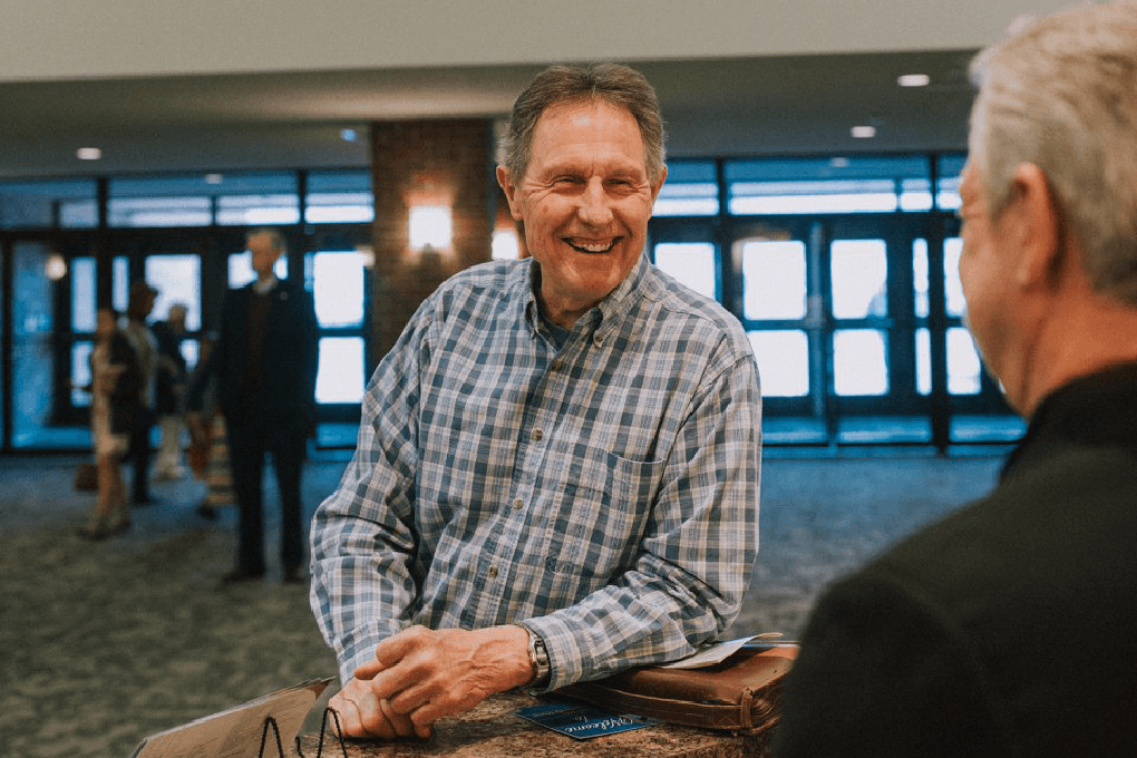 Man smiling at a desk