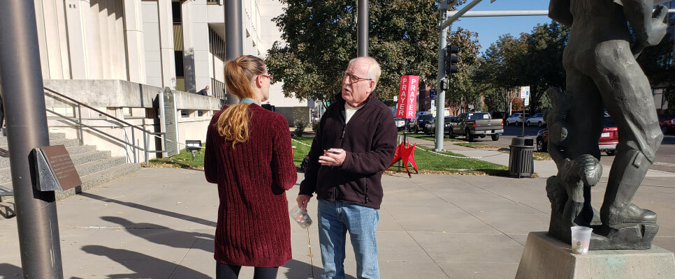 Man sharing the gospel with someone